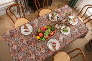 Detail of bohemian jacquard tablecloth with shell patterns and heavy fringe texture