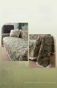 Detail of dark green floral sofa cover with elegant cream tassels and retro fabric texture
