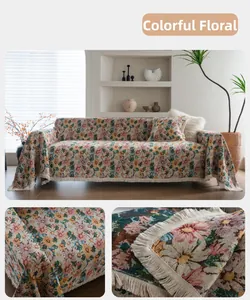 Detailed macro view of multicolor floral jacquard chenille sofa cover with tassel fringe