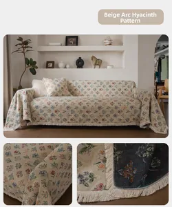 Close-up of beige chenille sofa cover featuring floral jacquard and elegant tassels