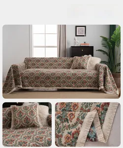Close-up of Bohemian floral jacquard sofa cover fabric with long fringe decorative trim