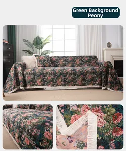 Close-up of green floral jacquard sofa throw fabric texture and decorative fringes