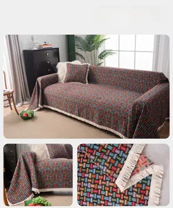 Close-up of bohemian woven sofa cover with colorful patterns and elegant fringe details