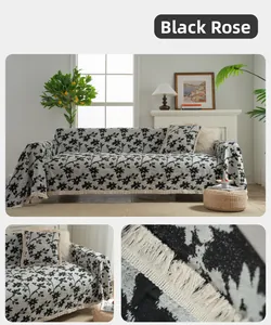 Detailed close-up of thick beige sofa cover with black rose patterns and tassel fringe edge