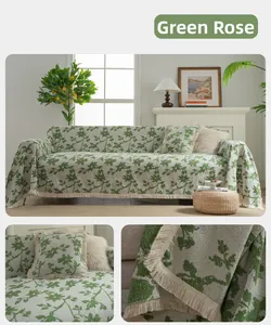 Detail of green rose jacquard chenille sofa cover with vintage floral texture and fringe