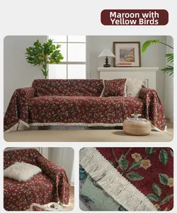 Detail of red thick woven sofa cover with tassels and vintage bird pattern textures