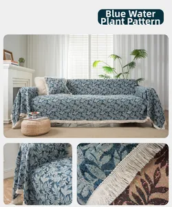 Detail of blue water grass jacquard chenille sofa cover with decorative fringe edges