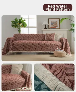 Close-up of red water grass pattern sofa cover with detailed woven tassel edges