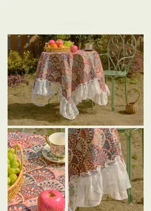 Detailed jacquard ginkgo pattern tablecloth with elegant lace ruffle hem in garden setting