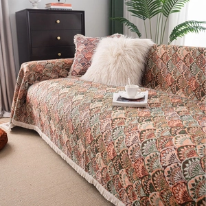 Housse de canapé bohème avec motif écailles orange vintage et bordures à franges