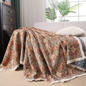 Housse de canapé de style fermier avec motifs géométriques et bordures à franges