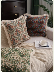 Detail of American jacquard pillowcases with vintage floral patterns and tassel edges