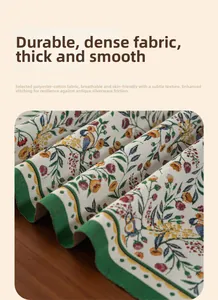 Close-up of classic green jacquard table runner with vintage bird and floral patterns