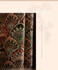 Detail of vintage American floral cotton curtain fabric with plant patterns and fringes