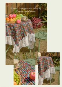 Detail of colorful jacquard woven fabric with elegant white lace ruffle edges for tabletop