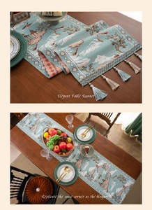 Detail of blue-green jacquard table runner with mountain patterns and decorative tassels