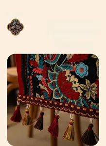Close-up of Chinese style floral jacquard table runner with handmade tassels and hemmed edges