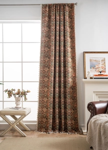 Detail view of retro Jacquard curtain with colorful patterns and delicate white tassels