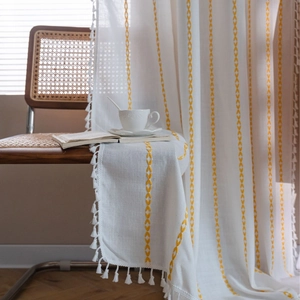 Boho white semi-sheer curtain with yellow geometric embroidery and tassel edges