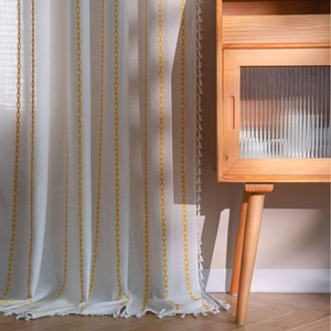 Minimalist beige linen curtain with yellow geometric embroidery and white tassels
