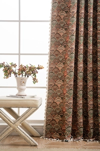 Detail of American retro jacquard curtain with fan pattern and beige tassel fringe