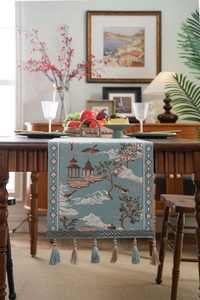 Detailed embroidery of pavilions and pine trees on a blue Chinese style table runner