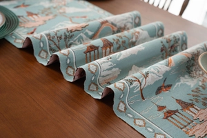 Detailed texture of blue jacquard table runner with classical Chinese pavilion and pine patterns