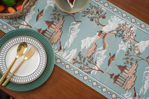Detail of high-quality jacquard table runner with blue oriental landscape and pagoda pattern
