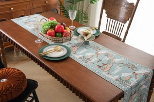 Detailed embroidery of Chinese pavilions and bridges on a high-quality table runner