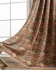 Detail of retro jacquard curtain with scalloped floral patterns and white fringe trim