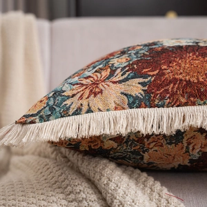 Close-up of American style jacquard sofa pillow with intricate floral patterns and tassels