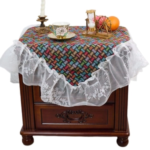 Colorful geometric jacquard tablecloth with elegant white lace ruffles and floral embroidery