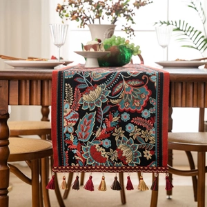 Classic Chinese jacquard table runner with red floral patterns and colorful tassels