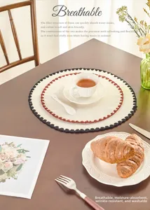 Detailed texture of cotton linen round placemat with wave edges on a wooden dining table