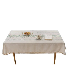 Moderne beige Tischdecke aus Leinen mit Blumenstickerei und eleganten Quasten am Rand