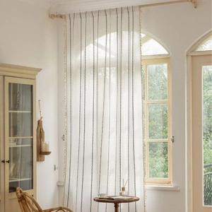 Boho semi-sheer white curtain with black chain embroidery and tassel trim for windows