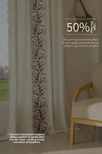 Detail of American pastoral curtain with vine embroidery and tassel edges in natural light
