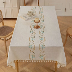 French country linen tablecloth with blue floral embroidery and white fringe tassels