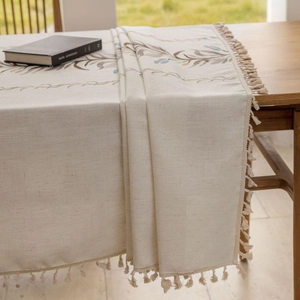Nordic minimalist cotton linen table runner with leaf embroidery and elegant tassels