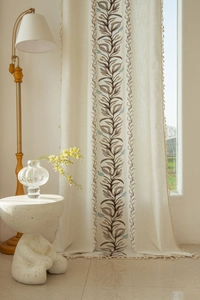 Close-up of embroidered leaf pattern and tassel edge on American pastoral style curtain
