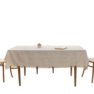 Minimalist beige cotton linen rectangular tablecloth with elegant fringe tassels for dining