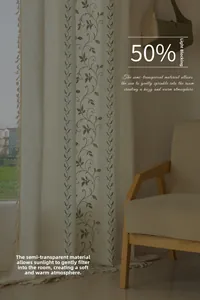 Detail of beige sheer curtain with green embroidery and fringe, 50% blackout fabric