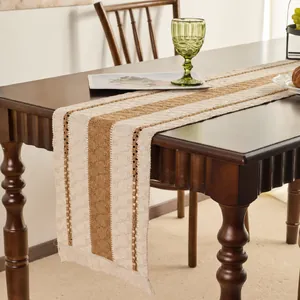 Detail of American retro table runner with beige and brown stripes and woven tassels
