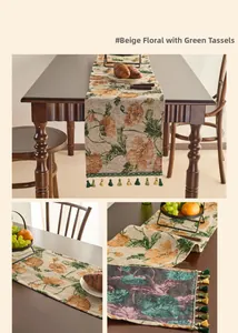 Detailed view of floral jacquard table runner with decorative fringe tassels on wood