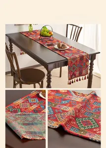 Close-up of geometric jacquard patterns and colorful tassels on a folk style table runner