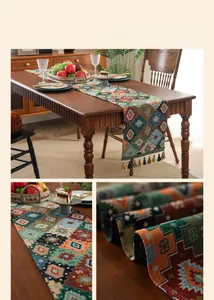 Detail of bohemian jacquard table runner with geometric patterns and fringe tassels