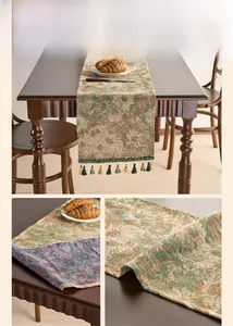 Detail of vintage oil painting style floral jacquard table runner with green tassels