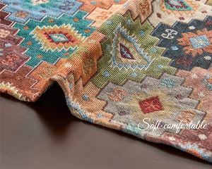 Detail of bohemian geometric table runner featuring thick jacquard weave and soft tassels