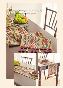 Close-up of bohemian geometric jacquard table runner with colorful tassels and texture
