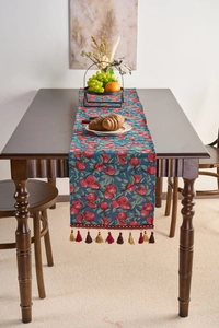 Detailed view of vintage table runner featuring red apple jacquard and woven fringe edges